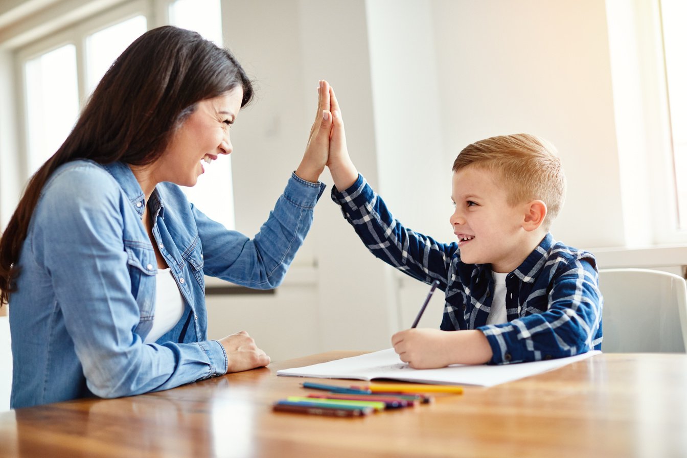 Mom Giving Son a High Five